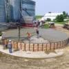 pouring concrete for grain bin