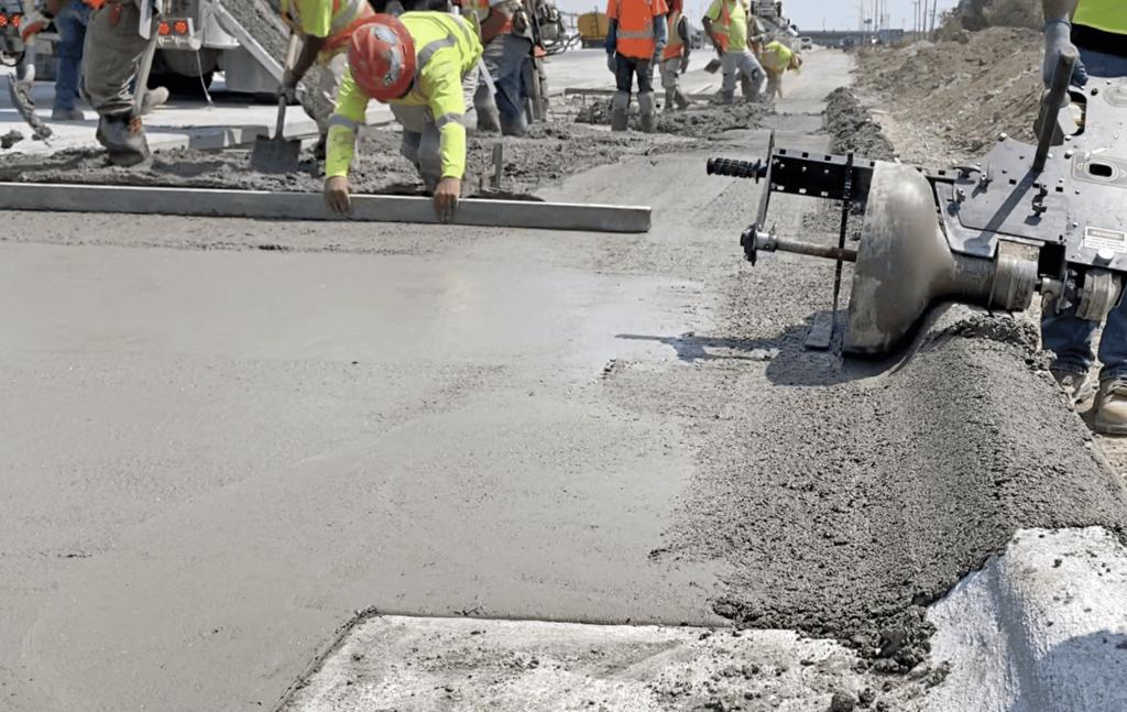 Hand Screed next to Curb Maker